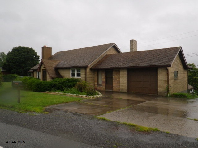 Ebensburg- 3 BR brick ranch decorated with wood trim throughout. plaster walls, modern kitchen with appliances. 3 baths. Dining room & family room. finished basement. Gas FA heat. garage. 3 extra separately deeded lots. A must see!