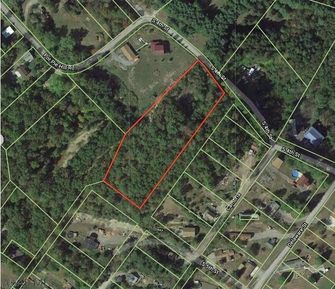 2.17 acres of mostly wooded land in Grazierville. Old septic system on property (condition unknown)