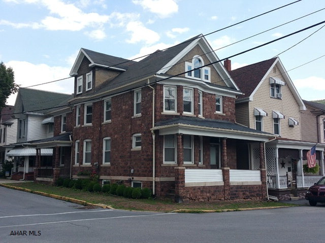 2 1/2 story brownstone, double house in convenient location. 3 bedrooms each side. Separate utilities. Thermopane windows. 2nd unit is 214 W. 10th Street Tyrone.