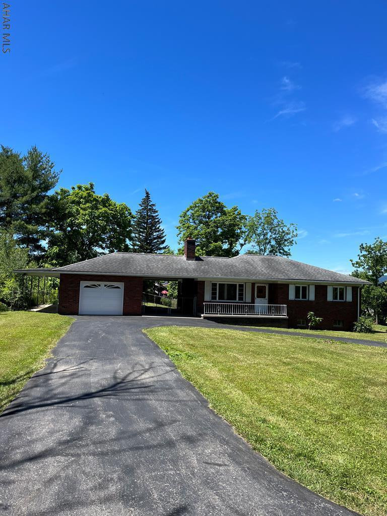 NEW new new .. Water Heater, finished basement (bar tops), Main Bath ,well bladder, pressure valve, UV light, sewer & gas line.  Redone hardwood floors and .3 ac side lot(left side) that could make this one awesome property once cleared off.  Tons of space!List of improvements in docs.
