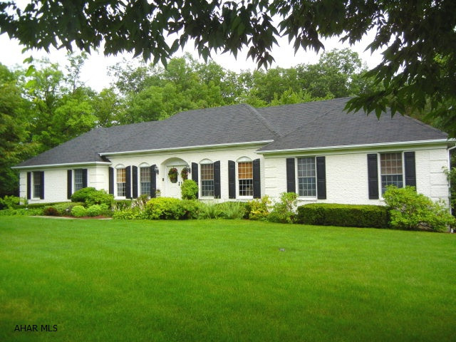 Custom built  rancher on a professinally landscaped lot. Heated In-ground pool 16x32 with privacy fence, pool cabana, dining Gazebo,& exterior sound system. 110 front projection theater w/Harmon Kardon & Sony Sound components. Hardwood and tile flooring and plaster walls. 5 Zone hot water baseboard heat and dual-zone air conditioning. Full attic w/stairs. Large deck w/custom awning & accent lighting. Detached oversized garage. Superior Craftsmanship.