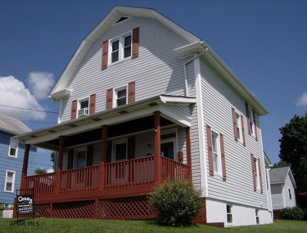 Ebensburg- 2  story, 3-4 BR vinyl sided home on a large corner lot. Remodeled kitchen. Gas hot water heat. Large front porch. 1 car detached garage & pavilion.Seller will pay normal closing costs