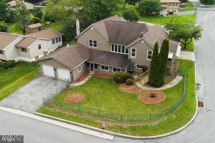 Pictures & Video COMING SOON! Showings start Tuesday July 14, 2026. Opportunities like this don't come along often. Tucked into Altoona's quiet Fairview neighborhood just minutes from Penn State Altoona, this spacious 3,200-square-foot home offers the flexibility today's buyers are looking for. The true game changer is the fully self-contained lower-level apartment with its own private entrance, creating incredible possibilities for multigenerational living, extended guest accommodations, or potential rental income thanks to its convenient location near campus. The main level features approximately 1,800 square feet of comfortable living space with three bedrooms and two full bathrooms, including a private primary suite. The heart of the home is the inviting kitchen, complete with an eat-at island, fireplace, and space for a dinette table, creating a warm gathering place for family and friends. Just beyond the kitchen, the dining room is filled with natural light from a beautiful bay window and flows seamlessly into the spacious family room, making entertaining effortless. You'll also enjoy both an enclosed front porch at the front door and a screened porch off the kitchen, providing the perfect spots to relax and enjoy the outdoors under cover. The lower level adds incredible versatility with a large recreation room, laundry room, half bath, and direct access to the attached two-car garage. The highlight is the fully self-contained apartment featuring its own private locking entrance, full kitchen, dining area, living room, and an en suite bedroom with a full bathroom. Whether used as an in-law suite, guest quarters, private home office, or potential rental opportunity, this space opens the door to countless possibilities. Additional highlights include a high-efficiency Carrier Weathermaker 9200 gas furnace with central air conditioning, a newer water heater installed in 2019, fresh interior paint upstairs, professionally cleaned throughout, and parking for up to six vehicles between the attached garage, driveway, and additional side parking area. Conveniently located just minutes from Penn State Altoona, Fairview Park, Little Orchard Park, shopping, restaurants, and I-99, this move-in ready home combines space, flexibility, and location in one exceptional package. Whether you're looking for your forever home, multi-generational living, or an investment opportunity, 201 Winding Knoll Road is ready to welcome you home.