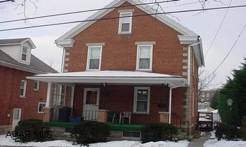 Good solid brick home in popular in-town location. Modern kitchen with breakfast area, deck, 1.5 baths, newer windows, nice yard with off street parking. 2 heated rooms on 3rd floor. Additional room on second floor with bookcases currently used as library/office, could be a 3rd bedroom.
