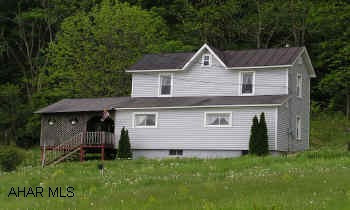 2-story Frame/vinyl w/ addition. 5BR/2BA on 1.5+ acres with new 2-car garage, barn, outbuilding and pond. 1st floor laundry, fireplace in family room, fruit trees, 2 tier deck
