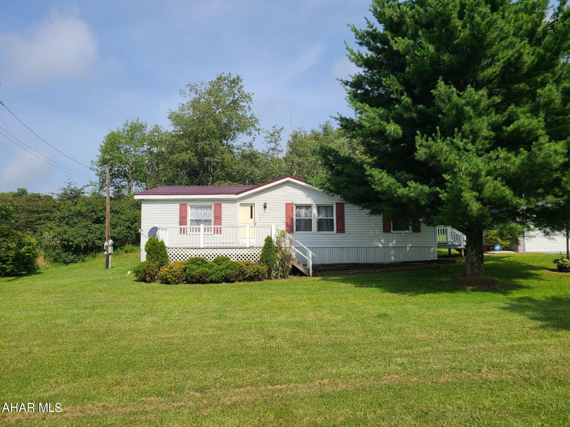 Secluded almost 1/2 acre lot set in serene surroundings. Nicely updated, with new flooring, kitchen, paint, roof & skirting. Recently certified septic system, water purity, piers and strapping. Much needed 2 car garage for mountain top living! Perfect for starter, to downsize, retire or for nature lovers. Call today for your tour