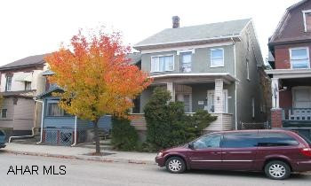 2 1/2 story brick, up & down rental units.