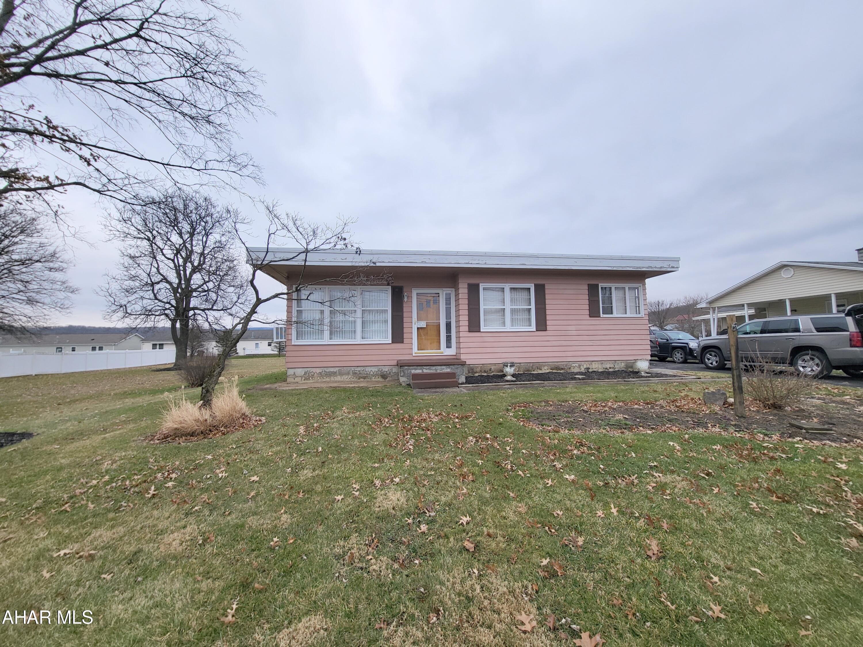 Frankstown Township - this sweet one story, 2BR, 1BA home offers a garage and large 150x200 foot lot! Off the garage is a shed and spacious covered patio.  The house has beautiful hardwood floors and an abundance of closets.  The unfinished basement also offers so much potential for expanded living space.  Needs some TLC, but ready for your imagination.