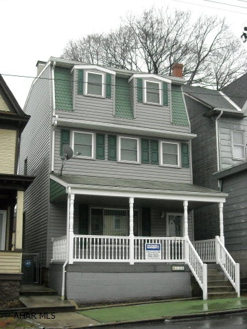 Reduced!! Nicely updated large 3+ bedroom home with rubber roof, windows, vinyl siding, 100 amp breakers, copper plumbing, new concrete sidewalks & patio.  3 Zone-controlled GFA furnace with central air, full bath with shower, appliances, decent carpeting, ceiling fans & recessed lighting. Media room/den on finished 3rd floor with bedroom (must see!)& high-tech wiring, good closet space, nursery/walk-in closet on 2nd floor. More to say--drive by today. Average heat:$78.50/mo. Low Taxes!! Even has a two-car garage!  Easy to see...