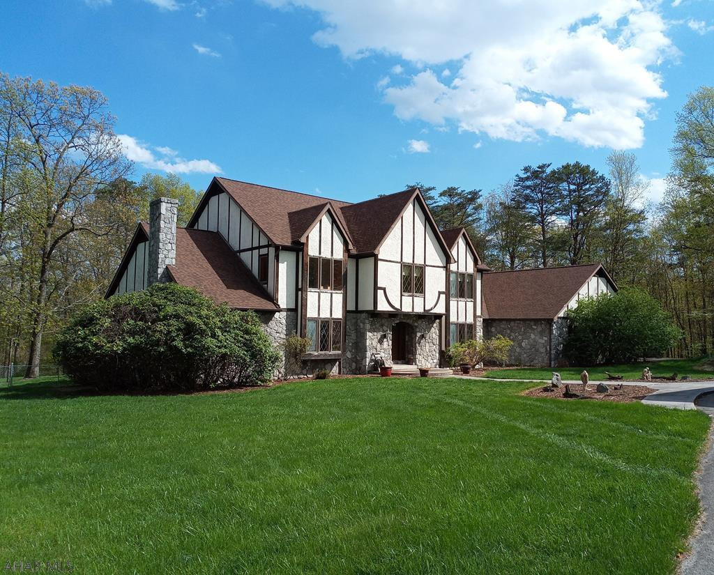 Sheltering in place would be no problem in this Raystown Retreat, conveniently located in Leffard's Bench off Piney Ridge.  The possibilities are endless with this unique property.  It boasts a 4-5 BR, 6 BA home with large spacious rooms and open floor concept. Enjoy entertaining in the large first floor rec room with wet bar, sauna, hot tub and 3/4 and 1/2 bath.  Cathedral ceilings, sky lights and custom windows abound to let in the outdoors. There is a large 48 x 96  pole barn to store all your toys. If you're looking to increase your living and outdoor space, this is the home for you.  You'll love working from home in the study with bay window, french doors to deck, insulated sound barrier. Minutes to Raystown Lake.  Call for inquiries.