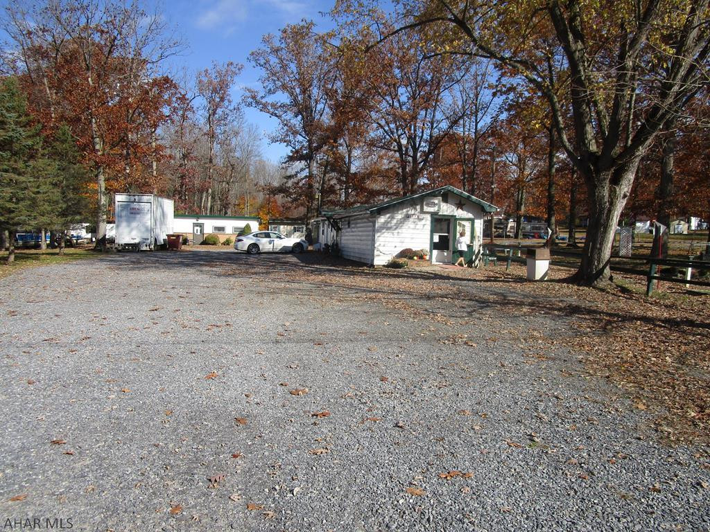 Going business located on Marina Road near Prince Gallitzin State Park - Sharons Pizza. Includes real estate, equipment, inventory and 19 hole miniature golf course. Game room for additional income. Additional block constructed cottage (needs some updating). Pizza building has new roof and plumbing. Great opportunity to own your own business.