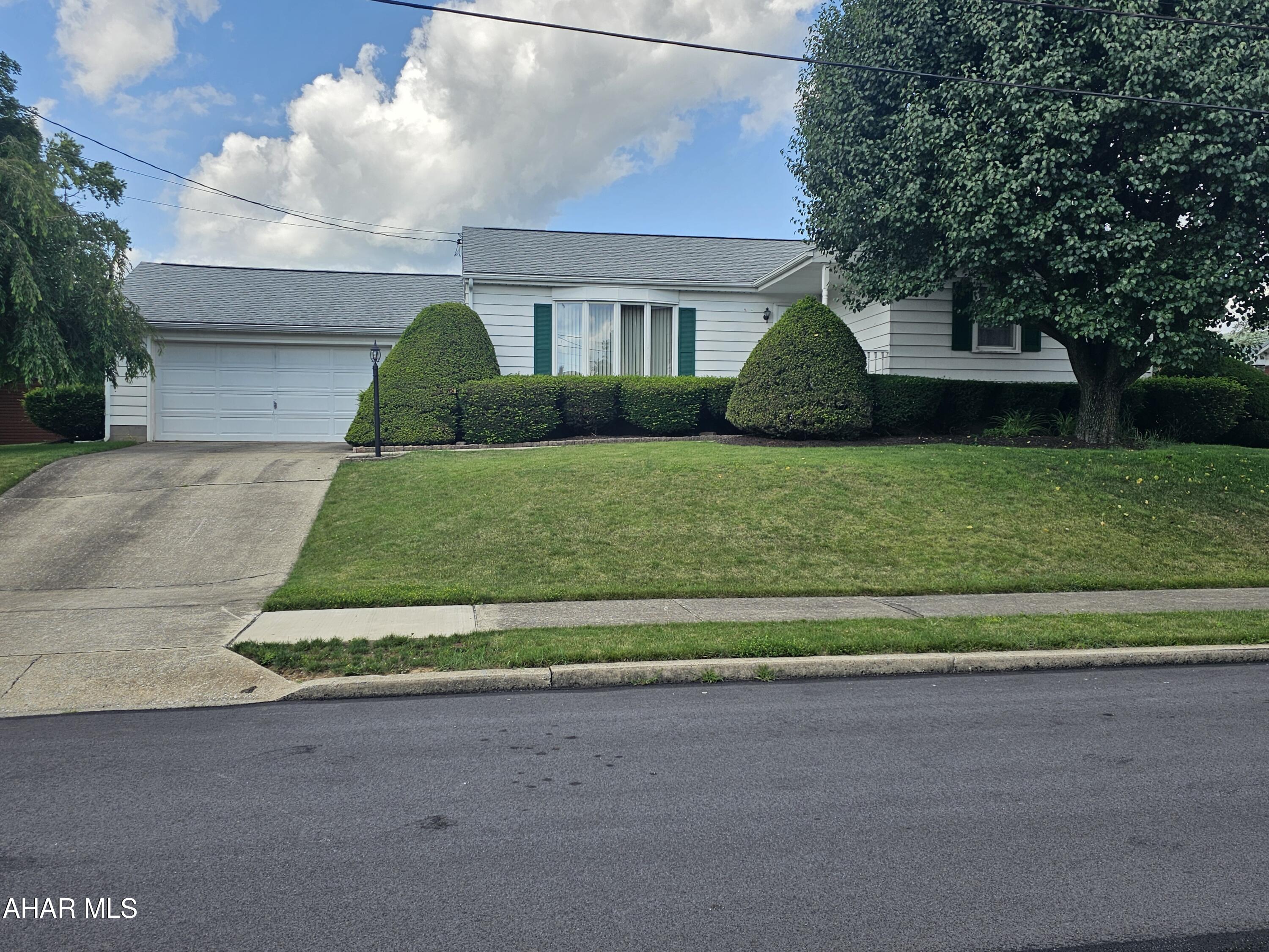 This home sits in a very desirable street in Roaring Spring!! The yard is huge, you could easily put in a pool, make it your own back yard oasis!!! Kitchen was updated several years ago, this home only ever had one owner so it was well loved. The oak hardwood floors under the carpets are beautiful! You would be so close to stores, restaurants ,brewery, coffee shops ,and the  hospital. This is a ranch style home so if your looking to down size or a first time home buyer this would be a good one to start with !! Give me a call to schedule a tour !!!