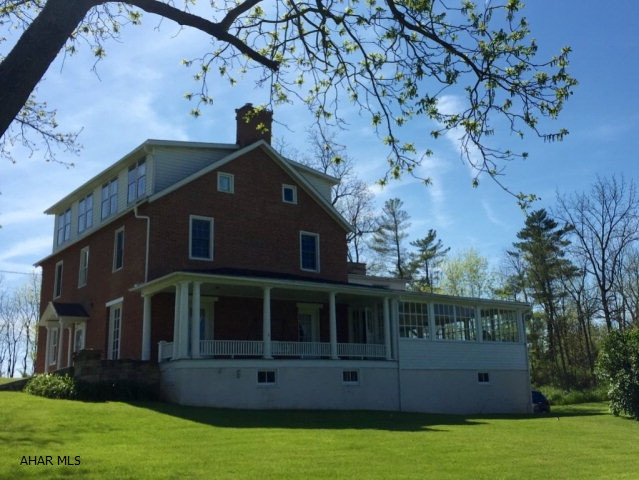 Restored circa 1815 historical home in historic Bedford County on 1.7 acres surrounded by lush landscaping. The home has been exquisitely restored and small details make this home simply stunning. The owner's suite is huge and offers private bathroom, sitting room and kitchen. 3 additional bedrooms share another full bath. The 3rd floor could offer an additional 900+additional living space. The first floor has a large eat in kitchen, formal living and dining rooms,sun room and office or bedroom. The deep recessed Windows, fireplaces, custom woodwork,covered porches, stone and brick exterior and stately columns add tremendous character.
