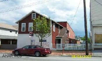 Store & 2 apartments on 2nd fl. Store frontage along Magee Avenue.