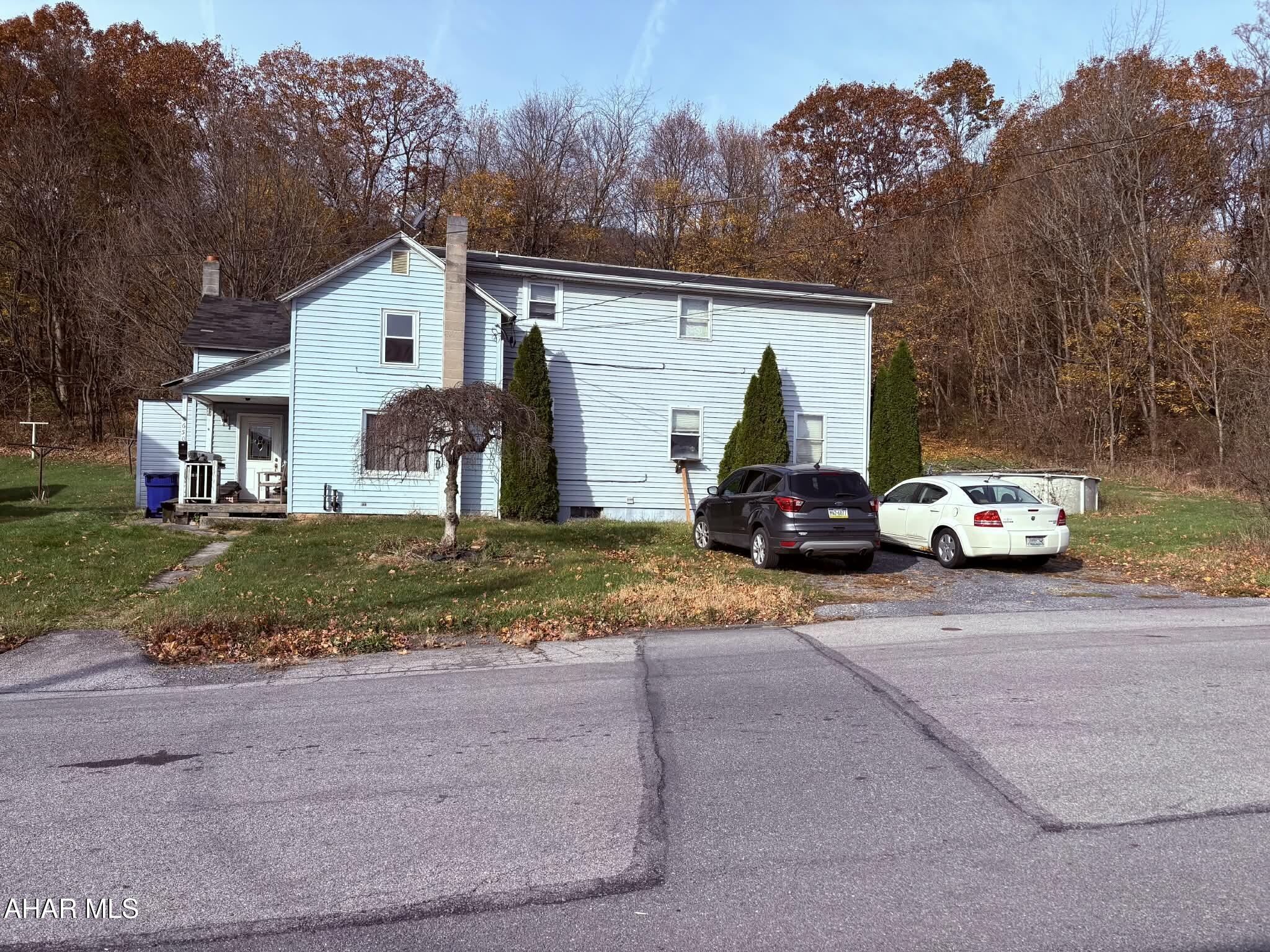 Calling all investors!! Large house and large lot with a lot of potential. The roof over the kitchen area ONLY is leaking and needs to be replaced .The house needs TLC .It's close to town, within walking distance to all the stores, restaurants and downtown attractions. The Large family rooms make it a great family home . Parcel G9 B4 141 located in the rear of the property has 1.26 acre available for potential. The House is Sold AS-IS!!