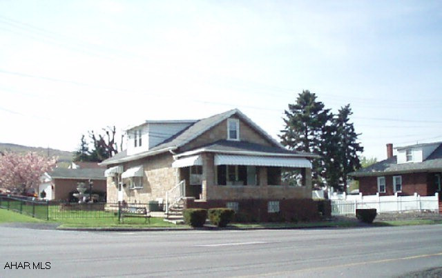 Stone story and a half on well landscaped corner lot.  Sunroom.  Oversized garage and picnic pavilion.  Convenient to everything!