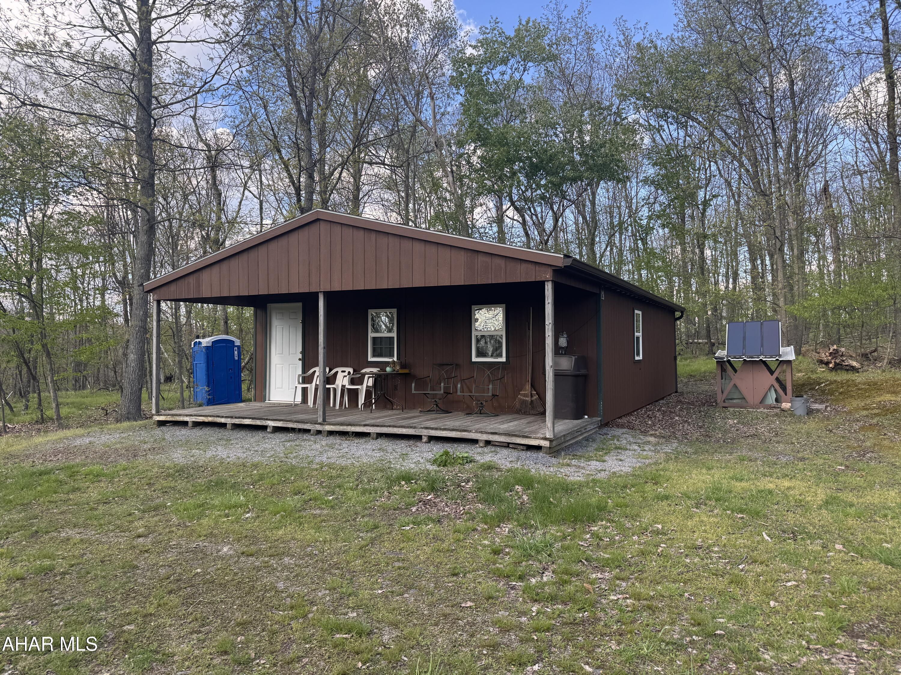 Primitive hunting camp on 18.4 wooded acres. One story frame camp with 2 bedrooms and kitchen, living area combo. Private lane access (approx 100yds+) in length. Camp has no well, septic (porta john) and elect is from a generator. Great getaway not far from the city to go back in time! Good hunting area.