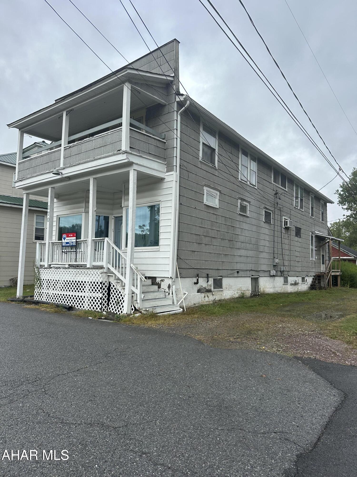 Comparable sale. 2-unit building with detached garage. First floor apartment includes open living room/bedroom, eat-in kitchen w/ laundry hook ups, updated bath with walk in shower, pantry and basement access. Second floor apartment includes living room, kitchen, dining room, 2 bedrooms, full bath, laundry room and a balcony.
