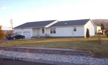 Carpet was professionally cleaned, please remove shoes or stay on runners.  3 bedroom, 2 bath ranch on corner lot. Features vaulted ceilings, skylights, open floor plan, white kitchen with ceramic tile counter tops, central air, 2 car garage, and enclosed rear porch.