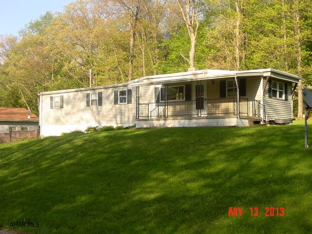 3 BD/1.5 BA manufactured home sitting on a foundation w/ integral garage. The private level lot contains a detached two car garage and outbuilding. It is close to Dunning's Creek for recreational activities and its covered porch and large deck allows you to enjoy the views. Priced to sell AS-IS.
