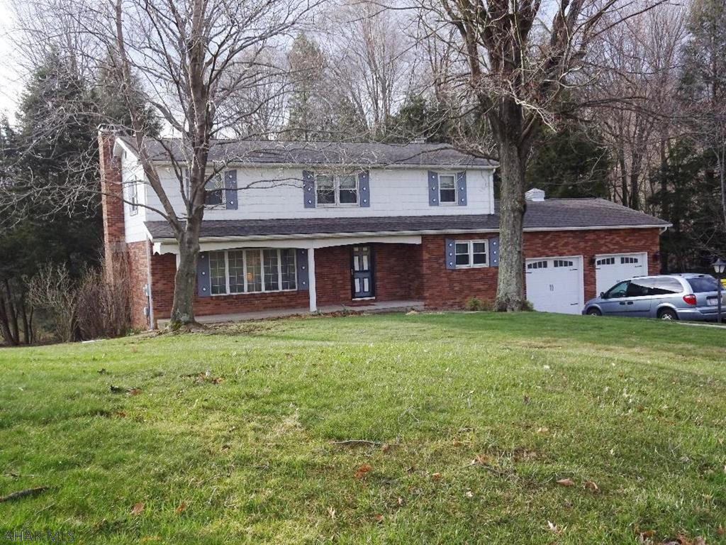 Spacious rooms through out! Hardwood floors, 2 fireplaces, four bedrooms, quality construction. Located on a quiet street. 3 parcels of land - 1.2 acres. A must see!