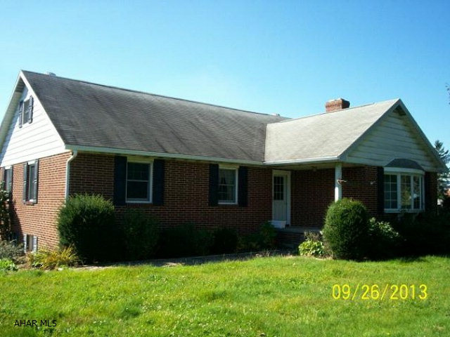 Ebensburg- 2 story 5 BR brick home on a 150 x 404 lot. Finished basement with hot tub. 2 car attached garage.