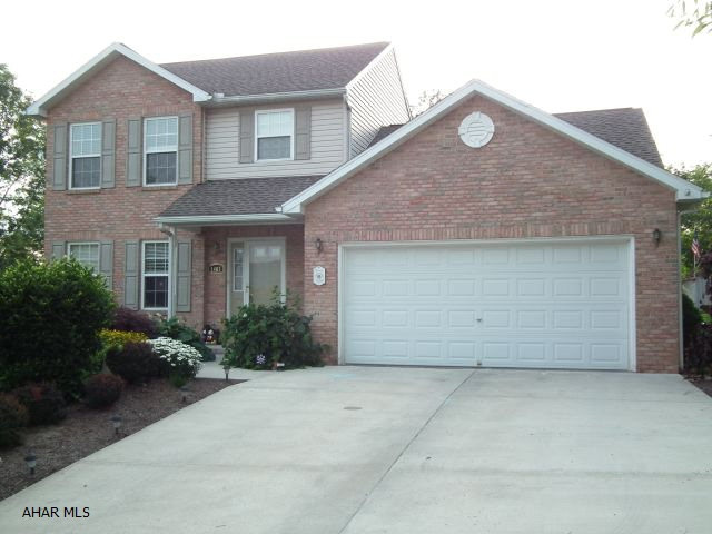 Situated on quiet street, this brick and vinyl home has everything you need to move family in! Beautiful laminated floating block floors in kitchen, eating area and family room with open floor plan. Kitchen has corian counters and glass block back splash. Large deck off eating area in kitchen, 2 1/2 baths, family room in basemnent for kids area. Tastefully decorated, great yard and landscaping, 2 car garage, heat pump.