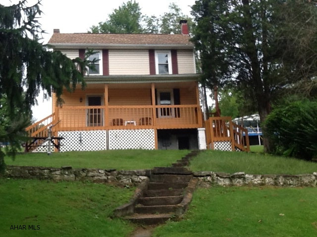 If you have always wanted a hunting lodge but couldn't afford it, look no further.  Home has new front porch, newer windows and roof.  The deed includes two separate parcels of land each with sewer and road accessibility.   Less than 1 miles from State Game Lands