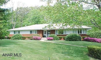 Beautiful brick and frame rancher in excellent condition. Prestigious location, landscaped setting
