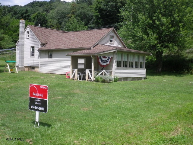 Cute starter home outside the city, but close to all amenities.  Hardwood floors under carpet in the living room & master bedroom.  Newer furnace.  Septic tank cleaned approximately 2 years ago.  Water softener is rented.  Needs some TLC.