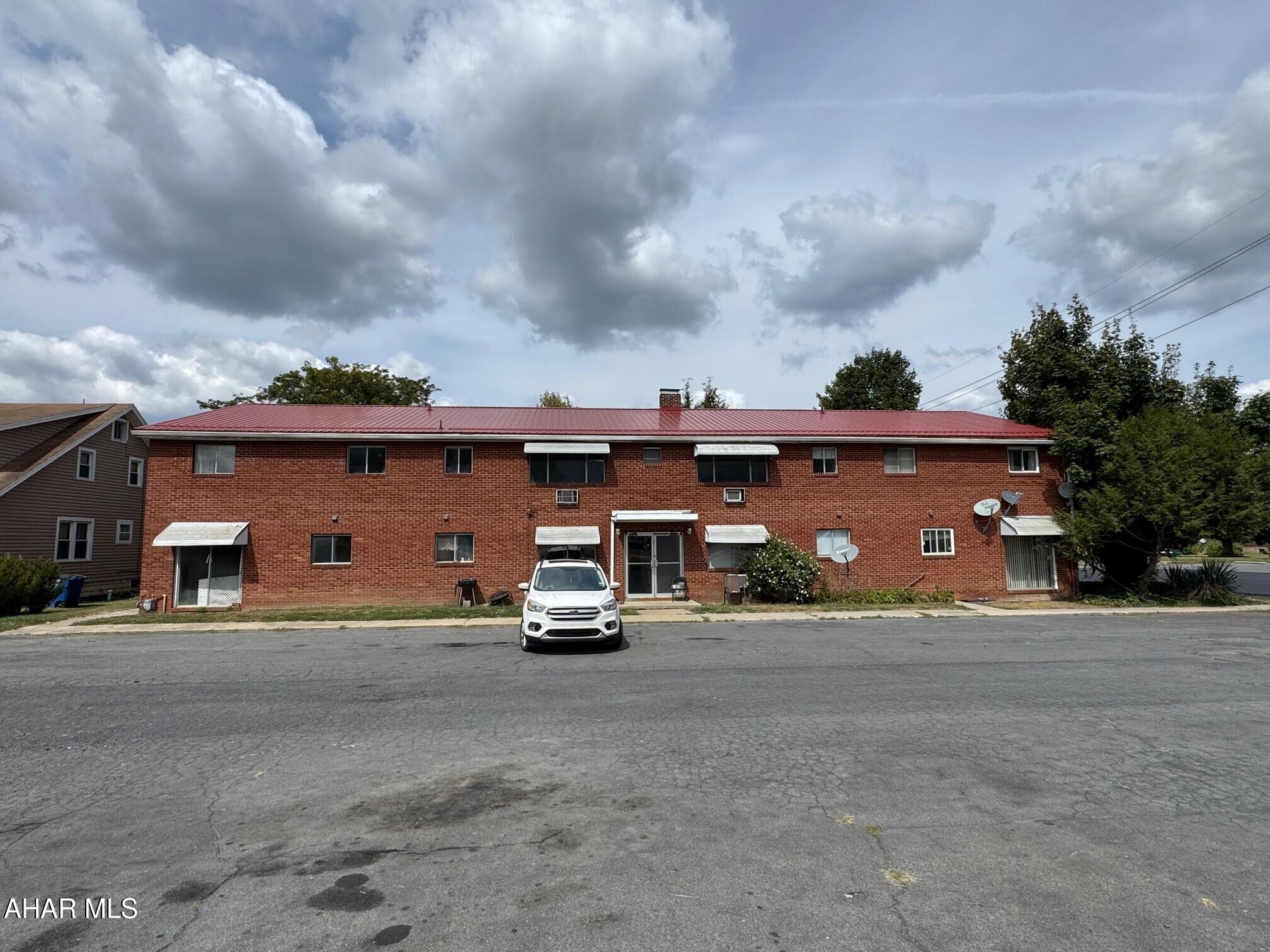 12-unit brick apartment building located in the Bedford Borough!! Great location just outside the downtown area and convenient to all amenities. The first level contains 8, one-bedroom apartments and the second level contains 4, two-bedroom apartments. Tenants pay water, sewer, and electric. Owner pays heat. Heat is natural gas, hot water. Partial basement with tenant laundry area and large rear parking lot. Only two of the units are currently occupied. Many of the apartments need a total remodel and update. With some work, this could be a terrific opportunity for an investment and cash flow. Apartment buildings with this many units are a rare find in the Bedford Borough.