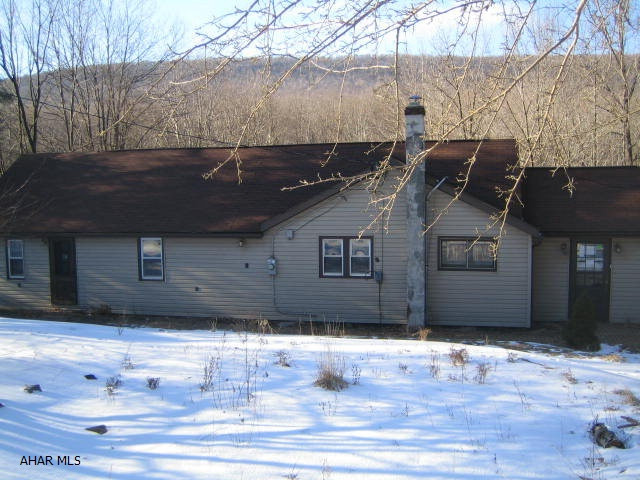 Sinking Valley one story home on .8 acre lot. Newer kitchen and bath, nicely decorated. Vinyl siding and windows, updated electric, large 2 car concrete block garage and shed. Property sold as-is. Seller will make no repairs. Offer must be submitted through HUD approved broker. Buyer pays both transfer taxes.