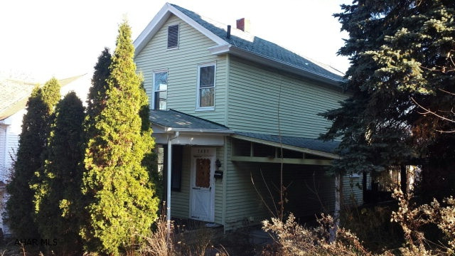 Handyman Special!  Home sits on double lot.  Oak kitchen cabinets.  3 bedrooms, 1 bathroom.  Off street parking with carport attached to house.  Sold As Is.  Owner makes no repairs. Utilities are off, bring flashlight.