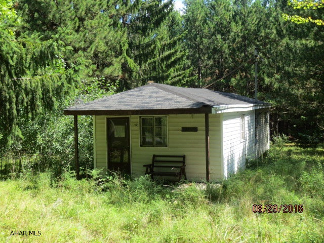 old hunting camp in poor condition.The wiring & plumbing was stolen and there is no heat. There is a drilled well and public water is available but not connected