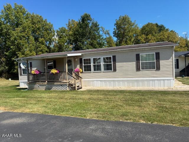 Great opportunity to own a home in this 55 and older community. Very convenient location close to shopping & restaurants. Nice front porch to relax with this lot being next to the woods. Open kitchen with dining area, main bedroom with private bath and additional 2 bedrooms and bath. Must see