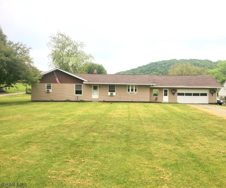 Looking for a new place to call home? Just outside of town you will find this 1 story ranch style home that offers 3 bedrooms, 1 bath, a galley kitchen with freshly painted cabinets and new kitchen flooring.  Enjoy a large open living room for entertaining family and friends or sit outside on your covered porch and enjoy your morning or evening beverage.  After a long day kick up those feet  and relax at your new home sweet home.  Enjoy being outside of town but conveniently located a close distance to restaurants, I99 and the PA Turnpike.