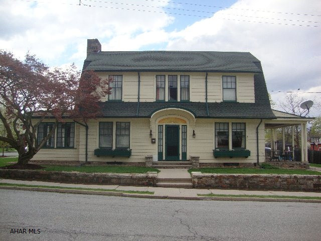 Terrific 4 bedroom borough home on corner lot with a 3 car garage. Original stone fireplace in living room. Updated eat in kitchen, hardwood floors, new bathroom, pretty sunroom. Terrific location. Walking distance to grocery store, the Diamond, schools, YMCA and Sheetz.