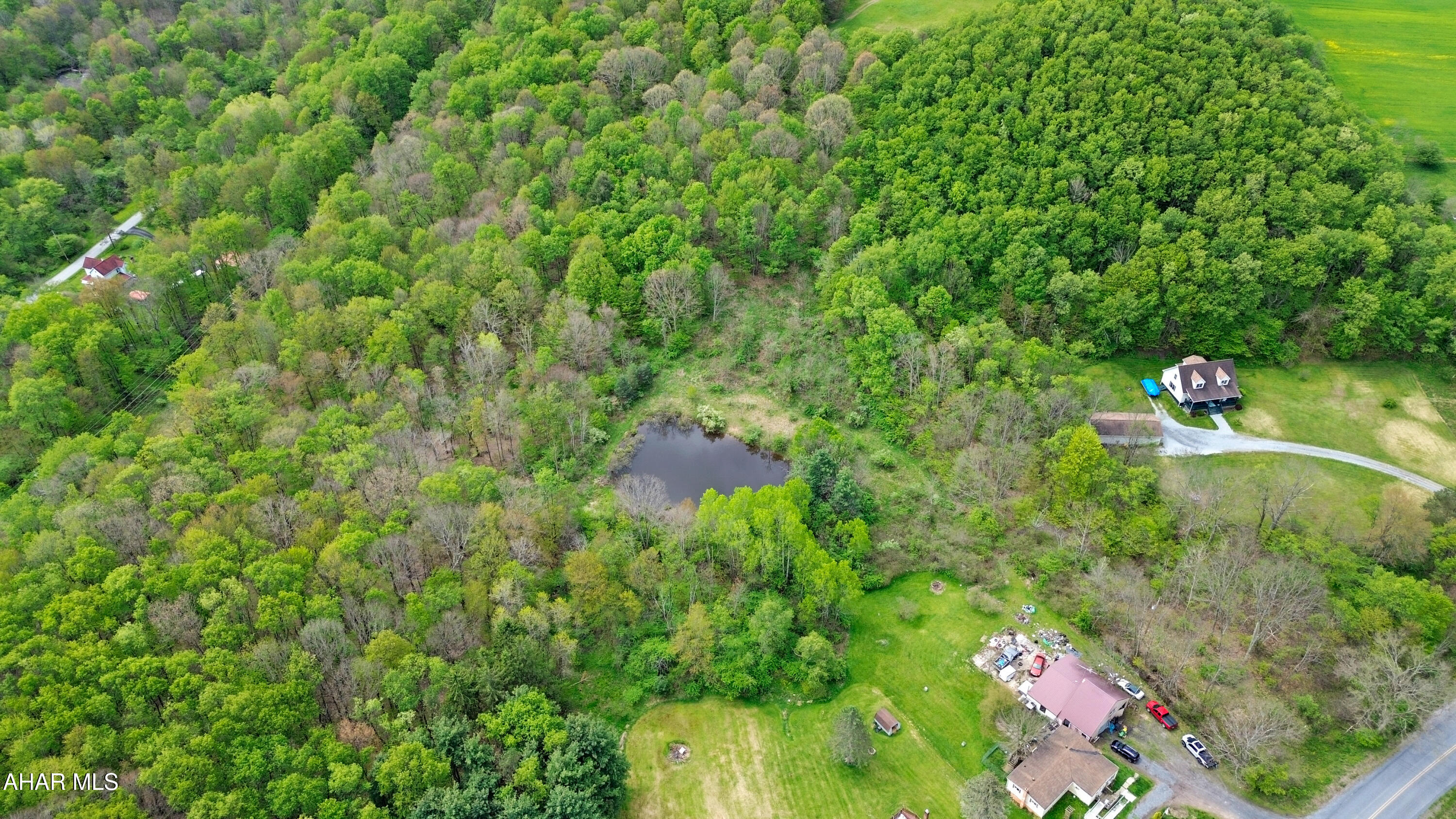 Welcome to this beautiful approximately 2.3 acre property located in the Penn Cambria School District! Tucked away with a deeded right-of-way for access, this scenic parcel offers the perfect blend of privacy, nature, and convenience. The property features a large pond, rolling terrain, and several cleared areas that would make an ideal homesite, getaway cabin, or campsite overlooking the water. Mostly wooded for added seclusion and charm, the land provides a peaceful setting while still offering public water at the street and public sewer already ran to the property. Whether you are looking to build your dream home, create a recreational retreat, or invest in land with potential, this property is a must see. Call today for more information!
