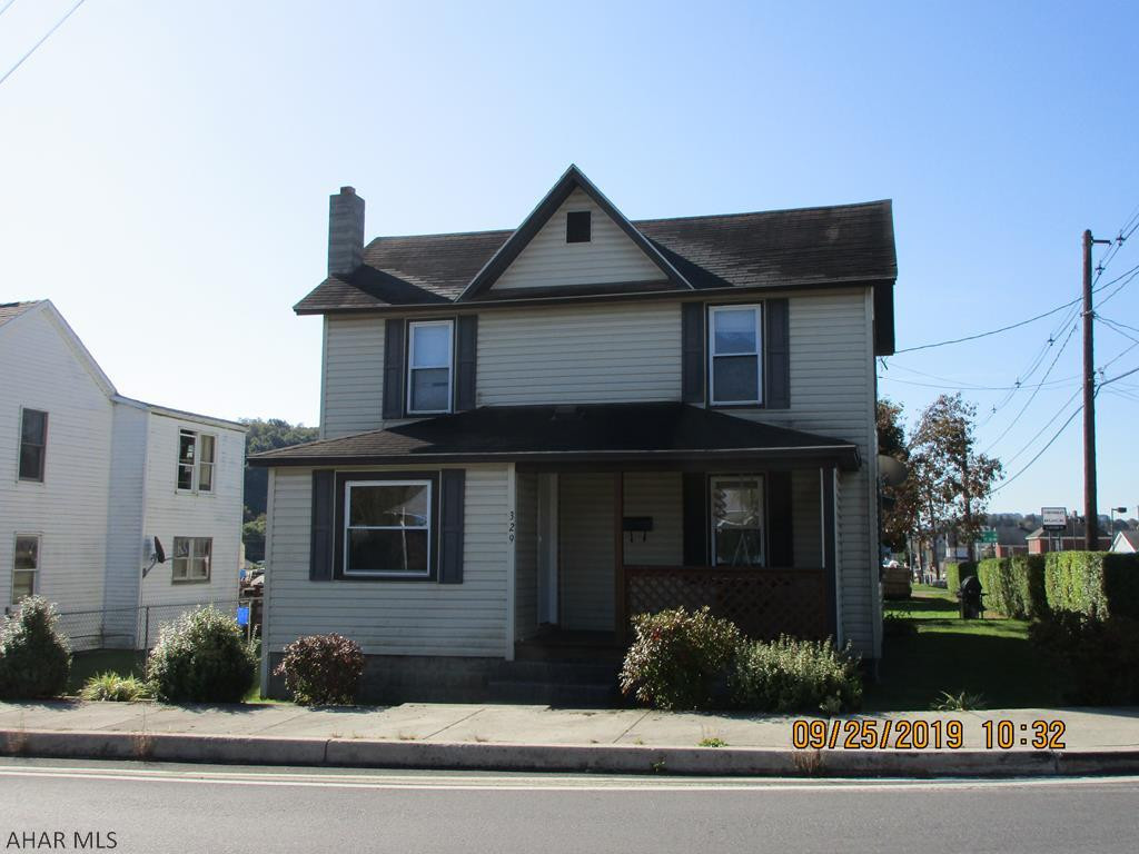 Check out this beautiful  2 bedroom house with updates on a landscaped corner lot on the outskirts of town. This home features a rear deck, off street parking, a mudroom and spacious living and dining rooms!