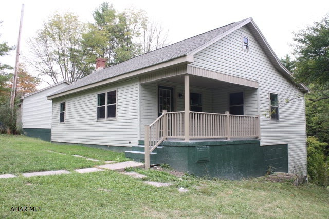 Completely renovated; New seer heat pump system, Central air; new roof,siding, windows, kitchen, bath, floor covering, water heater, plumbing, soffa/fascia, etc. It does need gutter and downspouts and some landscaping.