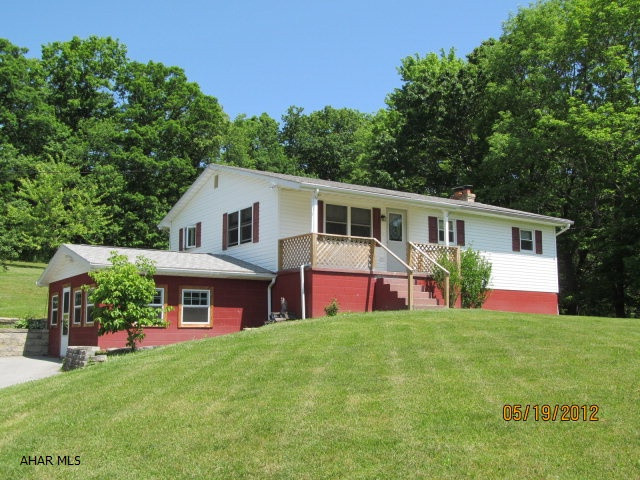BRING OFFERS!! Motivated seller! If you've got toys this is the place for you!  Country living and privacy with over 3 acres of beautiful property, 2 garages with a total of 5 stalls and there's a house to live in too, with an updated kitchen, newer windows, roof and heating system. Bellwood Schools - come take a look and check out the spectacular view!