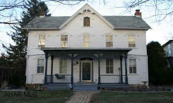 2-Story Traditional home, Victorian stlye, center-hall design. Homey country kitchen, large dining room, living room w/fireplace. High ceilings, original millwork. Front and back porch. Creatively styled stained glass. Additional square footage on finished 3rd floor attic room, ideal for office or 5th bedroom. Main level laundry room. Barn or garage 25x34, garden shed 14x8.