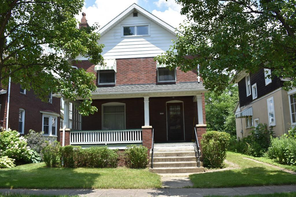 Tons of potential in this sturdy, 2 1/2 story brick home in a very desirable Hollidaysburg neighborhood, close to schools, parks, golf, shopping, restaurants and attractions! Gorgeous hardwood floors, lovely bay window with a window seat, beautiful woodwork and doors. There is a newer first floor addition for the laundry room and half bath. The inviting front porch is large and covered. There is a one-car, detached garage and off-street parking. Needs updates.Owner has had a new sump pump installed on 9/04/18. Old carpet was removed to reveal the gorgeous floors, some plaster repair and painting also done in kitchen, living/dining rooms and upstairs bedroom and closet. Total 2018 taxes are $2185.
