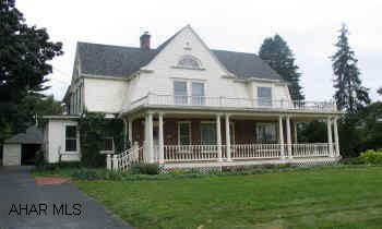 Upscale showplace, 5 bedroom, 2 full and 3 half bath home. Airy interior, large rooms, beautiful staircase, 3-fireplaces. This home has many unique features that were created by individual craftsmen.