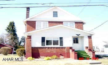 From I-99 to Bellwood exit. Rt. 865 to E. 4th Street, turn left, go to end, turn left. House on corner of Stone & Maple. Charming brick home, large screened florida room, enclosed front porch, many built ins. Delayed possesion June 30.