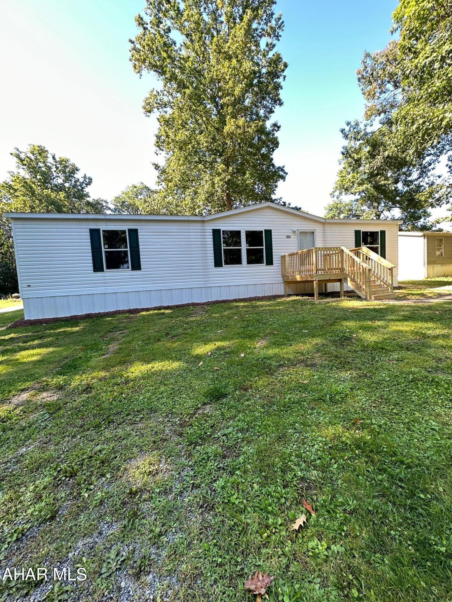 Beautiful brand new doublewide mobile home.  White kitchen with center island.  Stainless steel appliances.  Front and rear decks.   Corner lot.
Easy living all on one level.  Lot rent includes water, sewer, and trash removal.