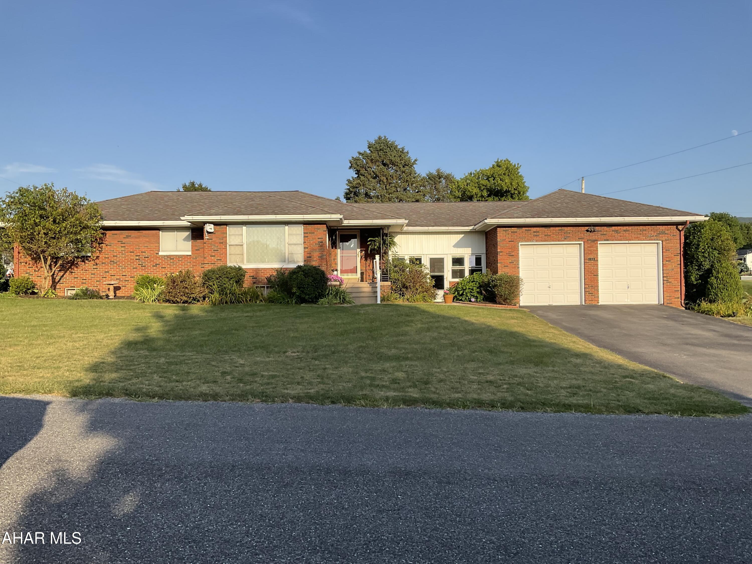 Welcome Home. This Lovely Brick Ranch style home in a rural setting yet close to Shopping, Doctors and Peaceful Country Living is Move In Ready to make it your own. Nestled on .37 acres, Corner Lot. This home offers Hardwood Flooring, an Updated Kitchen with Granite Counter Tops, Custom Cabinetry w/pull out shelves. The Formal Dining Room has French Doors leading out to a low maintanence Deck. Central Air welcomes you on hot summer days and nights. 3 spacious bedrooms offer a restful nights sleep. The Breezeway between the Garage and the house is additional living space that offers a Quiet Spot to unwind or entertain, enjoy Summer Days & Nights and all 4 seasons to the soft falling snow while the Pellet stove keeps you cozy and warm. The Over Sized 2 Car Garage is perfect for your Vehicles, and storage for your recreational Toys & Lawn equipment. Also this home offers a unique feature...a Summer Kitchen for canning your harvest! The Full Size Basement with high ceilings is waiting for your personal designs. Weather you are downsizing or raising a family, this house will suit all of your needs. Call for your Exclusive Tour Today.