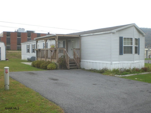Very Nice 2001, 14'x76' single wide. 2-Bed, 2-Bath, Kit, LR & Laundry Room. Front & Rear porches. Lot rent is $250.00 per month & includes trash & snow removal. Nice single-wide.