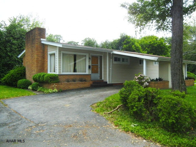 Solid 3 bedroom, 1 1/2 bath ranch home on large irregular corner lot.  Living room and bedroom have hardwood floors.  Fireplace newer, roof, furnace.  Some newer windows - dated.  Needs some cosmetics.  A nice property at a great price.
