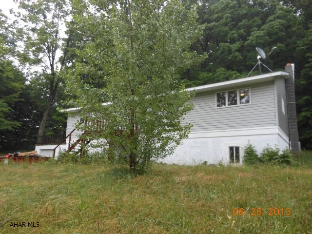 This is a lovely home in Northern Cambria School Distirct. It has a very nice kitchen with attached dining room. This home features three bedrooms with new carpet. The master bedroom has its own master bath-jacuzzi tub with tiled splash and shower. Large living room. The basement is large and unfinished. A deck for entertaining off the side of the home. 2 car attached garage with entry into the basement. Rural secluded area. Large 4.1 acre lot.